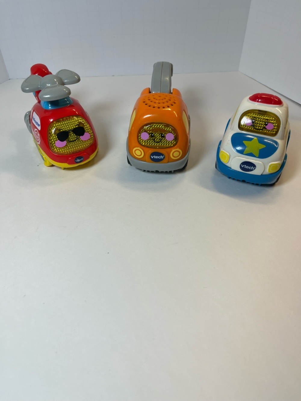 Kids VTECH Toy Vehicles - Red Helicopter, Orange Tow Truck, Blue Police Car Set